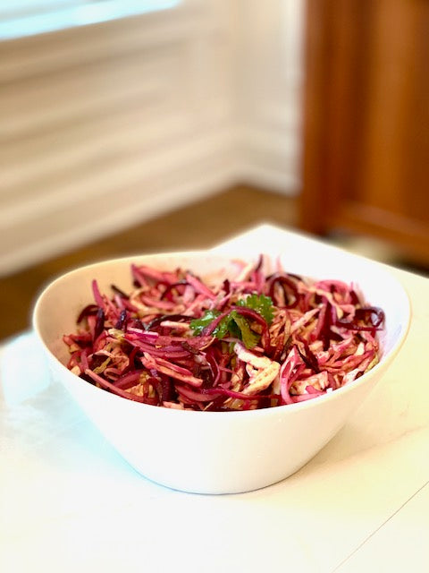 Coleslaw with spiraled beets and radishes